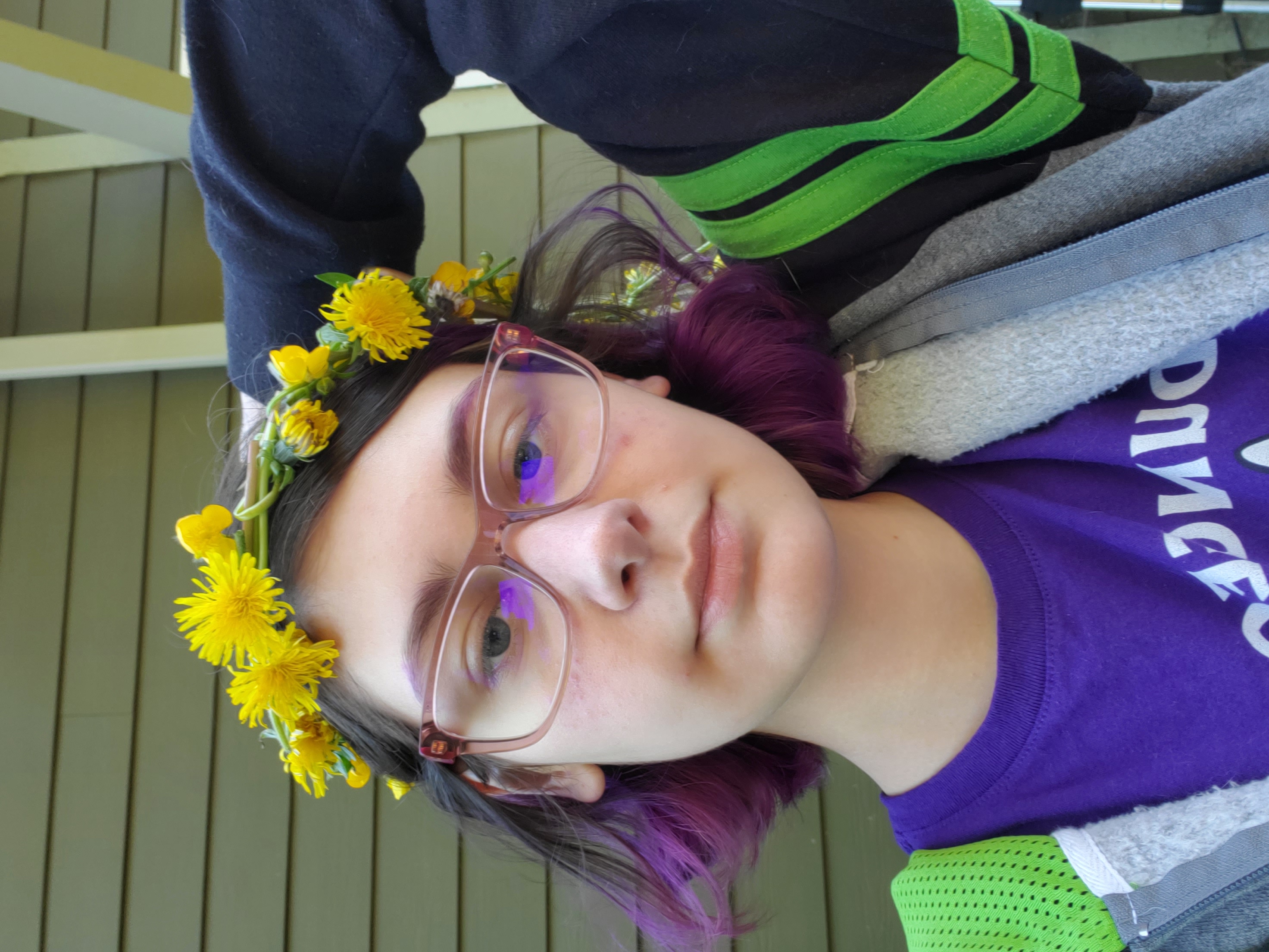 a photo of Ginger Farrar with a yellow flower crown